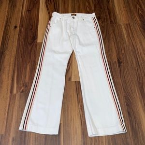 pol white jeans with red, blue, and cream stripes